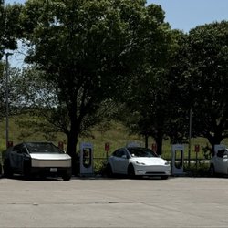 Tesla Supercharger - Charging stations with some shade.