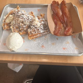 Waffle Champion - Cinnamon Roll Waffle with a side of bacon - Waffles Near Me - Oklahoma City, Oklahoma Waffle Champion - Cinnamon Roll Waffle with a side of bacon - Waffles Near Me - Oklahoma City, Oklahoma
