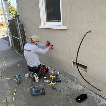 Fuse Service HVAC & Electrical - Eugene is pulling the wire and Yan is in the crawl space snaking the wire. As you can see the Tesla charger is snaked behind the wall. - Electricians Near Me - Sacramento, California Fuse Service HVAC & Electrical - Eugene is pulling the wire and Yan is in the crawl space snaking the wire. As you can see the Tesla charger is snaked behind the wall. - Electricians Near Me - Sacramento, California