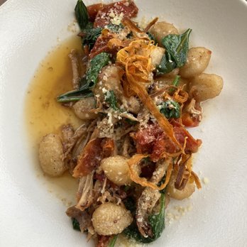 Heirloom Restaurant - Rabbit confit with gnocchi, spinach, roasted tomatoes, and crispy shredded carrot. - New American Near Me - Midway, Kentucky