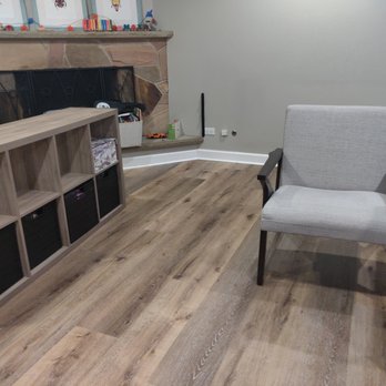 Simion Flooring - a living room with a fireplace - Flooring Near Me - Niles, Illinois Simion Flooring - a living room with a fireplace - Flooring Near Me - Niles, Illinois