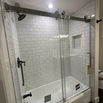 Vertex Pro Glass - Frameless tub double slider shower door in nickel - Glass & Mirrors Near Me Vertex Pro Glass - Frameless tub double slider shower door in nickel - Glass & Mirrors Near Me