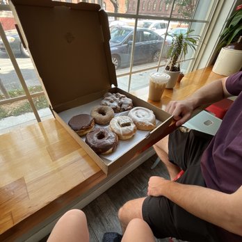 Dottie's Donuts - apple fritter, cinnamon roll, chefs special (spice chai with little cake), cinnamon sugar, Boston creme and chocolate frosted - Donuts Near Me - Philadelphia, Pennsylvania