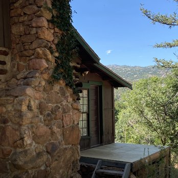 Keithley Pines Historic Cabins - Outside view of real wood burning fireplace. - Vacation Rentals Near Me - Manitou Springs, Colorado