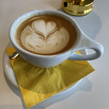 Beaucoup Cafe - a cup of coffee on a saucer - Cafes Near Me - Newport, Rhode Island
