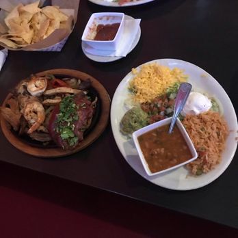 Jardin Corona - Condiment plate with cheese, guacamole, sour cream, rice and a bowl of beans. It was a lot of food! - Mexican Near Me - Marble Falls, Texas Jardin Corona - Condiment plate with cheese, guacamole, sour cream, rice and a bowl of beans. It was a lot of food! - Mexican Near Me - Marble Falls, Texas