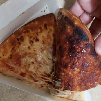 7-Eleven - No paper dividing slices. Cheese stuck to the bottom of another burnt slice. - Convenience Stores Near Me - Los Angeles, California