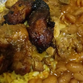 Tavares Restaurant - Yellow rice, pinto beans, stew chicken with a few pieces of yellow plantains - Latin American Near Me - Brooklyn, New York