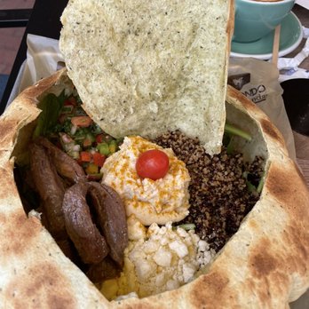 Macondo Coffee Roasters - Wesley Chapel - Mediterranean Bowl with flat steak. Quinoa, hummus, arugula, spinach, pico de gallo, crumbled feta, cherry tomato, in a tortilla bowl - Coffee & Tea Near Me - Wesley Chapel, Florida Macondo Coffee Roasters - Wesley Chapel - Mediterranean Bowl with flat steak. Quinoa, hummus, arugula, spinach, pico de gallo, crumbled feta, cherry tomato, in a tortilla bowl - Coffee & Tea Near Me - Wesley Chapel, Florida