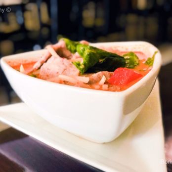Tip Thai - a bowl of food on a plate - Thai Near Me - Richmond, Virginia