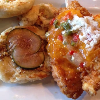 Crave Kitchen and Bar - Innards of fried chicken honey biscuit sandwich. Notice thinly sliced pickles. Yum. - New American Near Me - El Paso, Texas Crave Kitchen and Bar - Innards of fried chicken honey biscuit sandwich. Notice thinly sliced pickles. Yum. - New American Near Me - El Paso, Texas