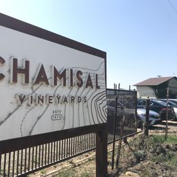 Entry sign and winery building in the background. Entry sign and winery building in the background.