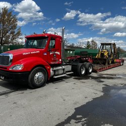 The Auto Barn - Our Lowboy is Used for Heavy Equipment!