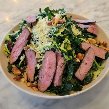 Flower Child - Kale & Brussel Sprouts Salad with added steak - New American Near Me - Newport Beach, California Flower Child - Kale & Brussel Sprouts Salad with added steak - New American Near Me - Newport Beach, California
