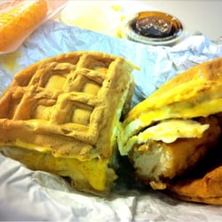 Rosko's Bagels & Waffles - Waffelicious Sandwich - Crispy Chicken, Egg & Cheese in a Belgian Waffle w/ Maple Syrup on the side. Also, a side of Hash brown.