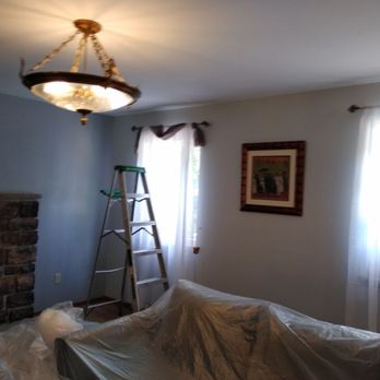 Price Rite Painting - Clarks Summit - Covering living room in Poconos painting interior accent walls. - Painters Near Me Price Rite Painting - Clarks Summit - Covering living room in Poconos painting interior accent walls. - Painters Near Me