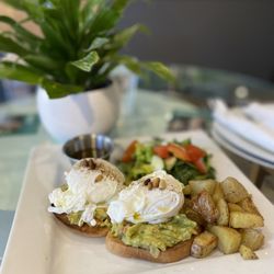 Omni RAW Materials Health - Gluten free Avocado toast with poached eggs, salad and home fries