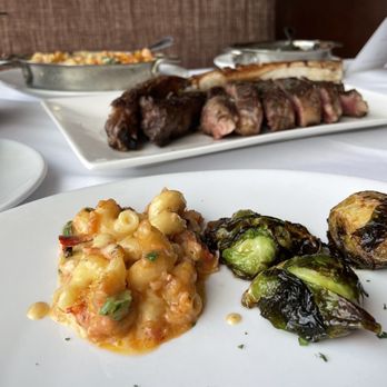 Fleming’s Prime Steakhouse & Wine Bar - 35 oz Prime Tomahawk* To Share Crispy Brussels Sprouts & Bacon North Atlantic Lobster Macaroni & Cheese - Wine Bars Near Me - Plano, Texas Fleming’s Prime Steakhouse & Wine Bar - 35 oz Prime Tomahawk* To Share Crispy Brussels Sprouts & Bacon North Atlantic Lobster Macaroni & Cheese - Wine Bars Near Me - Plano, Texas