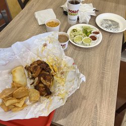 Pollo Regio - 1/2 roasted chicken, refried beans, rice, flour tortillas and different sauces.  The verde sauce is the best!