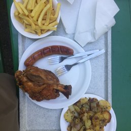 Roasted pork knuckle, with fries and potato dish