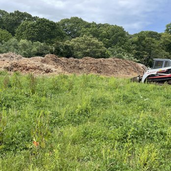 Treetola's Arbor Care Northfork - Wood chip stockpile - Tree Services Near Me - Riverhead, New York Treetola's Arbor Care Northfork - Wood chip stockpile - Tree Services Near Me - Riverhead, New York