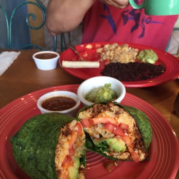 Yahaira's Cafe - Breakfast burrito with avocado and a side of guacamole and salsa. Babe ordered the special. - Mexican Near Me - Pasadena, California
