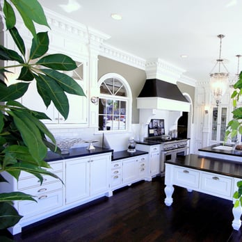 Showcase Design Build - A beautiful white kitchen and contrasting textured countertop by Showcase Kitchens and Baths - General Contractors Near Me - Thousand Oaks, California