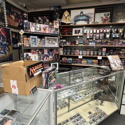 War Torn Front - Magic: The Gathering section. Not pictured on the right where I took the photo are more card sleeves, deck boxes and playmat tubes.