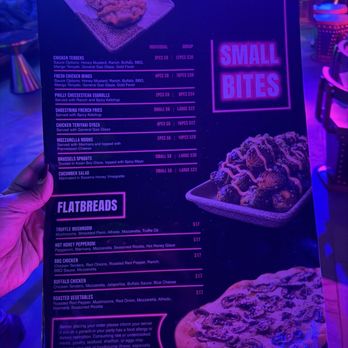 Stage Karaoke x Studios - Menu from Stage Karaoke x Studios in Allston, MA, displaying small bites such as chicken tenders, wings, cheesesteak eggrolls, fries, and chicken gyoza, along with flatbreads including mushroom, pepperoni, BBQ chicken, and vegetable options. The menu includes prices and portion sizes, with a focus on snack foods and shareable dishes for customers in a karaoke venue setting. - Karaoke Near Me - Allston, Massachusetts