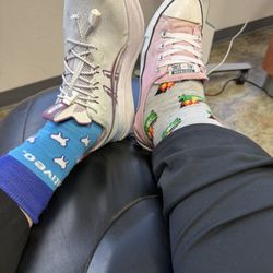 Central Dentist - Picture of two different legs wearing fun silly socks.