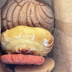 Ybarras Cake Shop - Sweet bread. I first ate the pink cookie.