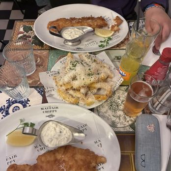 The Mayfair Chippy - Hake and haddock with Parmesan truffle fries, Fanta and a beer - Fish & Chips Near Me - London, XGL The Mayfair Chippy - Hake and haddock with Parmesan truffle fries, Fanta and a beer - Fish & Chips Near Me - London, XGL