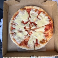 Comella's - A barely cooked pizza.