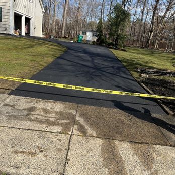 MiddleSex drives & patios - a paved driveway with caution tape - General Contractors Near Me MiddleSex drives & patios - a paved driveway with caution tape - General Contractors Near Me
