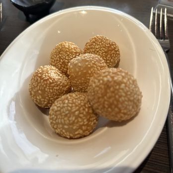 Pl8 - a bowl of sesame balls on a table - Asian Fusion Near Me - Barrington, Illinois Pl8 - a bowl of sesame balls on a table - Asian Fusion Near Me - Barrington, Illinois
