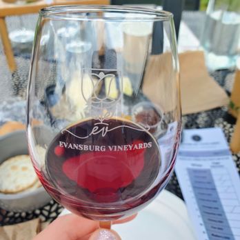 Evansburg Vineyards - a hand holding a glass of wine - Wineries Near Me - Collegeville, Pennsylvania Evansburg Vineyards - a hand holding a glass of wine - Wineries Near Me - Collegeville, Pennsylvania