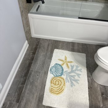 All Around Tile - Guest bathroom - tile floor and shower - Tiling Near Me - Sand Lake, Michigan