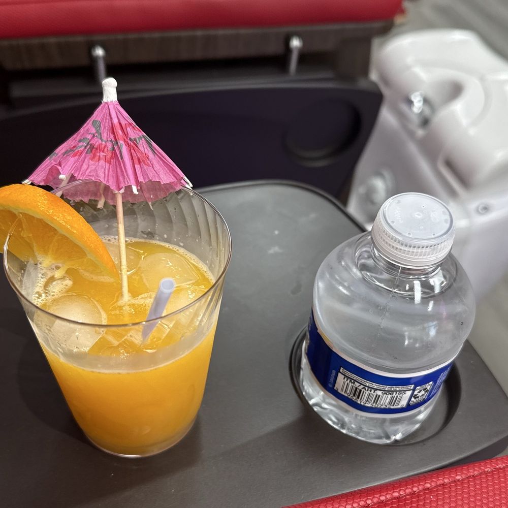 Complimentary orange juice & a bottle of water Complimentary orange juice & a bottle of water