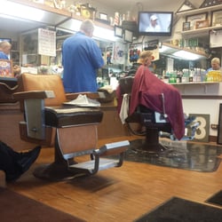 Ron's Barber Styling Shop - One in the chair 2 waiting...