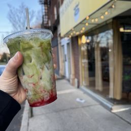Iced matcha latte with strawberry syrup