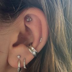 RM Tattoo & Body Piercing - Stacked lobe, rook and upper lobe piercing all done by Taya!