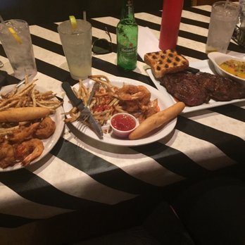 Crawdad's - three plates of food on a table - Steakhouses Near Me - Merigold, Mississippi