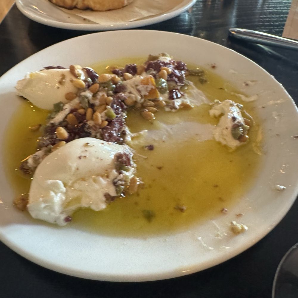 Bacaro Primo - Half eaten burrata.... The most perfect thing of our meal - Italian Near Me - Kansas City, Missouri
