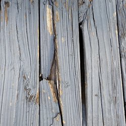 Island Time Inn - Close up of the broken boards. Clearly dangerous.