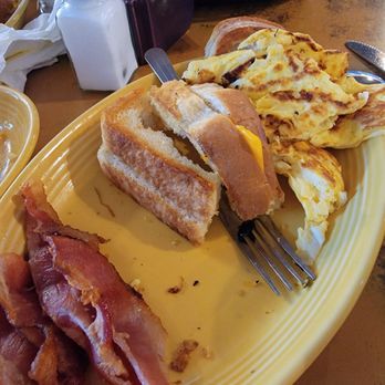 Outpost Cafe - Breakfast sandwich the 2nd time. Burned eggs and bacon not cooked all the way. Ate as a grilled cheese - American Near Me - Oak Hills, California