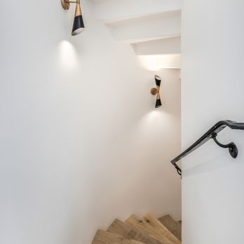 Mastercraft Home Services - custom curved staircase down to the basement cellar with new light fixtures. - General Contractors Near Me Mastercraft Home Services - custom curved staircase down to the basement cellar with new light fixtures. - General Contractors Near Me