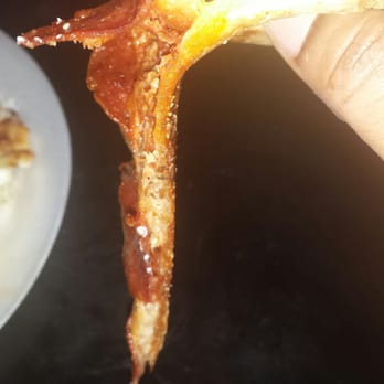 Pizza Hut - a hand holding a half eaten pizza - Pizza Near Me - Houston, Texas Pizza Hut - a hand holding a half eaten pizza - Pizza Near Me - Houston, Texas