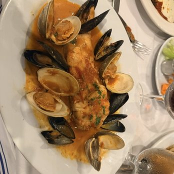 Armondo's Italian Restaurant - Sea Bass with clams, Mussels and tomato sauce. - Italian Near Me - Jackson Heights, New York