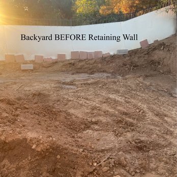 AV Concrete Works - Backyard before retaining walls, cement, grass, sprinkler system. - Masonry/Concrete Near Me - Palmdale, California