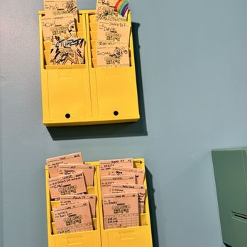 Illumination’s Minion Cafe - The minion's time cards! - New American Near Me - Orlando, Florida